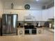 Kitchen features stainless steel appliances, white cabinets, and a functional layout at 1000 Ray Costin Way # 114, Murrells Inlet, SC 29576