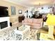 Open-concept living room with coastal decor flowing into the dining area and kitchen at 1000 Ray Costin Way # 114, Murrells Inlet, SC 29576