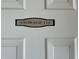 Close-up of a white door with a storage room sign numbered 114, showcasing unit accessibility at 1000 Ray Costin Way # 114, Murrells Inlet, SC 29576