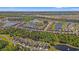 A scenic aerial view of The Parks neighborhood, showcasing beautiful homes, lush landscaping, and community lakes at 1087 Baker Creek Loop, Myrtle Beach, SC 29579
