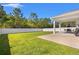 Spacious backyard with a privacy fence, covered patio, and lush green grass at 1087 Baker Creek Loop, Myrtle Beach, SC 29579