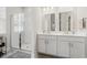Bright bathroom with dual sinks, and a glass-enclosed shower at 1087 Baker Creek Loop, Myrtle Beach, SC 29579