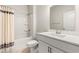 This bathroom features a shower-tub combo, a spacious vanity, and sleek fixtures at 1087 Baker Creek Loop, Myrtle Beach, SC 29579