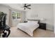 Cozy bedroom with neutral colors, a ceiling fan, and natural light from the window at 1087 Baker Creek Loop, Myrtle Beach, SC 29579