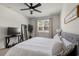 Cozy bedroom with neutral colors, a ceiling fan, a large mirror and soft natural light at 1087 Baker Creek Loop, Myrtle Beach, SC 29579