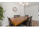 Dining room with hardwood floors, a large wooden table, and a decorative chandelier at 1087 Baker Creek Loop, Myrtle Beach, SC 29579
