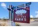 A stately metal sign welcomes residents and guests to 'The Parks' community with upscale housing at 1087 Baker Creek Loop, Myrtle Beach, SC 29579