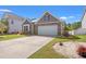 Well-maintained home with stone accents, lush landscaping, and a two-car garage at 1087 Baker Creek Loop, Myrtle Beach, SC 29579