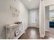 Bright foyer with hardwood floors, decorative console table, and stylish wall art at 1087 Baker Creek Loop, Myrtle Beach, SC 29579