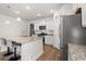 Bright kitchen features stainless steel appliances, granite countertops, and modern white cabinets at 1087 Baker Creek Loop, Myrtle Beach, SC 29579