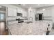 Modern kitchen with granite countertops, stainless steel appliances, and ample cabinet space at 1087 Baker Creek Loop, Myrtle Beach, SC 29579