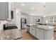 Bright kitchen features stainless steel appliances, granite countertops, and hardwood floors at 1087 Baker Creek Loop, Myrtle Beach, SC 29579