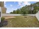 A large backyard is equipped with a wooden deck, fire pit and privacy fence at 1097 Stoney Falls Blvd., Myrtle Beach, SC 29579