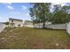 A spacious backyard with a privacy fence and established trees provides ample space for outdoor activities at 1097 Stoney Falls Blvd., Myrtle Beach, SC 29579