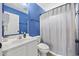 This beautiful bathroom features a blue accent wall and vanity at 1097 Stoney Falls Blvd., Myrtle Beach, SC 29579