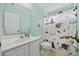 Charming bathroom featuring a single sink vanity, toilet, and decorative shower curtain at 1097 Stoney Falls Blvd., Myrtle Beach, SC 29579