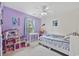 Bright bedroom with whimsical decor, including a dollhouse, desk, and comfortable bed at 1097 Stoney Falls Blvd., Myrtle Beach, SC 29579