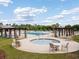 Relaxing community pool with a hot tub surrounded by lounge chairs and pergolas at 1097 Stoney Falls Blvd., Myrtle Beach, SC 29579