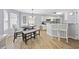 Bright dining area with a dining table, bench and kitchen views, creating a cozy and inviting atmosphere for Gathering meals at 1097 Stoney Falls Blvd., Myrtle Beach, SC 29579