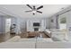 Bright living room features a ceiling fan, backyard access, and comfortable furniture at 1097 Stoney Falls Blvd., Myrtle Beach, SC 29579