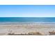 Expansive beach view showing ocean waves and sandy shoreline on a sunny day at 1105 South Ocean Blvd. # 806, Myrtle Beach, SC 29577