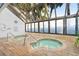 Indoor hot tub area with two small hot tubs surrounded by windows at 1105 South Ocean Blvd. # 806, Myrtle Beach, SC 29577