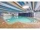 Bright indoor pool area featuring brick trim, ample lighting, and striped blue and white accents at 1105 South Ocean Blvd. # 806, Myrtle Beach, SC 29577