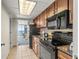 Well-equipped kitchen with granite counters and access to the living room at 1105 South Ocean Blvd. # 806, Myrtle Beach, SC 29577