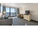 Comfortable living room with ocean view, dining table, couch and flat screen TV at 1105 South Ocean Blvd. # 806, Myrtle Beach, SC 29577