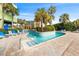 Scenic outdoor pool area with palm trees, lounge chairs, and lush landscaping at 1105 South Ocean Blvd. # 806, Myrtle Beach, SC 29577