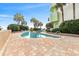 Expansive outdoor pool area with palm trees, resort-style landscaping, and building with balconies at 1105 South Ocean Blvd. # 806, Myrtle Beach, SC 29577