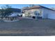 The backyard features a well-maintained lawn, complemented by landscaping and a privacy fence, ideal for outdoor enjoyment at 112 Rialto Dr., Conway, SC 29526