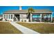 Community clubhouse offering a welcoming entrance, complemented by lush landscaping and visible amenities at 112 Rialto Dr., Conway, SC 29526