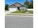 Charming one-story home featuring a well-maintained lawn and a white garage door at 112 Rialto Dr., Conway, SC 29526