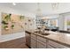 Modern kitchen with granite countertops and view of open living room at 112 Rialto Dr., Conway, SC 29526