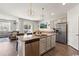 Open kitchen with granite countertops and stainless steel appliances, view to living room at 112 Rialto Dr., Conway, SC 29526