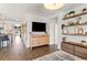 Stylish living room featuring an entertainment center and decorative shelving at 112 Rialto Dr., Conway, SC 29526