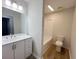 A simple bathroom has a white vanity and a shower/tub combo and a toilet at 116 Hickory Dr., Conway, SC 29526