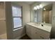 Bathroom view of a vanity with sink, mirror, lighting, and window at 116 Hickory Dr., Conway, SC 29526