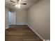 This simple bedroom boasts modern ceiling fan and new wood-look flooring at 116 Hickory Dr., Conway, SC 29526