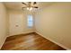 A simple bedroom has a double door closet, one window, and wood flooring at 116 Hickory Dr., Conway, SC 29526