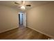 This simple bedroom boasts modern ceiling fan and new wood-look flooring at 116 Hickory Dr., Conway, SC 29526