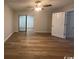 Spacious bedroom featuring new hardwood flooring and a ceiling fan at 116 Hickory Dr., Conway, SC 29526