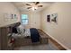 Bedroom with ample natural light, window views, closet, ceiling fan and wood floors at 116 Hickory Dr., Conway, SC 29526