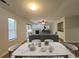 Bright dining area boasts wood floors and seamless flow into the living room at 116 Hickory Dr., Conway, SC 29526