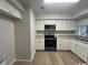 The modern kitchen is equipped with granite countertops and white cabinetry at 116 Hickory Dr., Conway, SC 29526