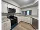 The modern kitchen is equipped with stainless steel appliances and white cabinetry at 116 Hickory Dr., Conway, SC 29526