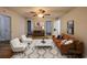 Well-decorated living room featuring hardwood floors, natural light, neutral paint, and modern furniture at 116 Hickory Dr., Conway, SC 29526