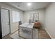 Well-lit home office featuring a modern desk, sleek computer setup, and elegant decor, perfect for productivity at 116 Hickory Dr., Conway, SC 29526