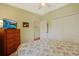 Inviting bedroom with a floral bedspread, light green walls, and access to a closet, offering a relaxing atmosphere at 1250 Camlet Ln., Little River, SC 29566